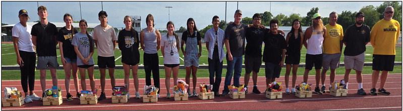 Madill celebrated Track seniors May 1 at Blake Smiley Stadium. Photo (l-r): Madill trackAssistant coach Brenda McHatton, BlayzeAdams, Kenzie Mathis, Hannah Elkins, Ben Hernandez, Korlee Cunningham-Martin, Bode Shahan, Haylee Elkins, Yailin Serrano, Armando Gonzalez, Tyce Pruitt, Anthon Rios, Angel Perez, Esperanza Hernandez, Madill track head coach Cale Eidson, assistant coach Scott Shaw, assistant coach Austin Pettigrew and assistant coach Kyle Callison. Courtesy photo