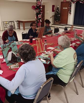 The Madill Rose Garden Club hosted a paint party where participants painted a cardinal in the snow. Courtesy photos
