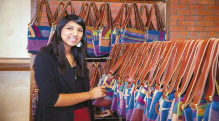 Taloa Underwood shows off the newest way to display Mahota Textile’s Southeastern inspirations: purses. Courtesy photo