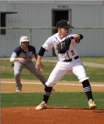 Wylbe Roberts makes the pitch as a Marlow runner is leading off of first base. Glenn Price • The Madill Record