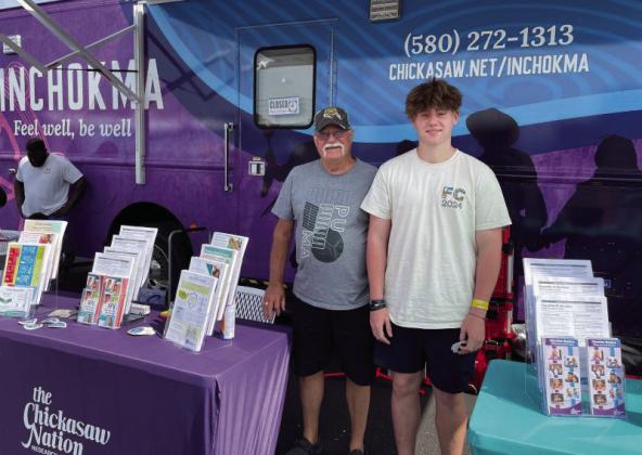 Wynnewood High School student and Chickasaw citizenTucker Hill, right, visits the Inchokma mobile unit with his grandfather Bill Davis, also of Wynnewood, during the Health and Hope on Wheels community resource event, Aug. 2, in Sulphur. Courtesy photo