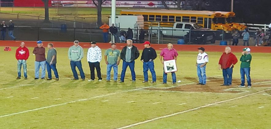 Members of the 1980 Kingston Redskins football team, Class B State Champions, were honored during a halftime ceremony during the game with Perkins-Tryon to celebrate the 40th anniversary of their title run. Members of the team carried a picture of Harold “Bulldog” Henry, an assistant coach on that team, who passed away in 1990. Michael Haggerty • The Madill Record