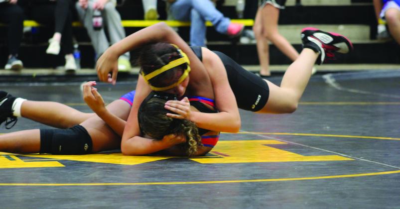 Valeria Barrientos tries to take down a Durant Lion. Summer Bryant