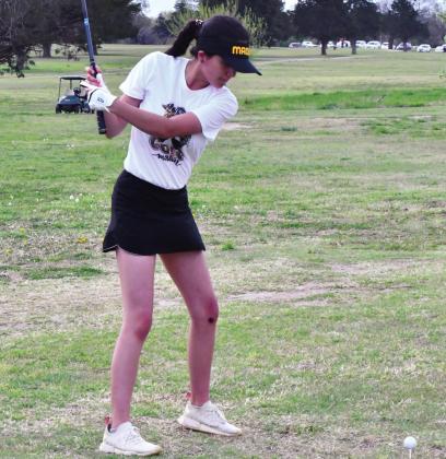 Samantha Silas measures up the ball before taking her swing. She shot a 119 during tournament in Sulphur on April 6, 2021. Jennifer Rushing