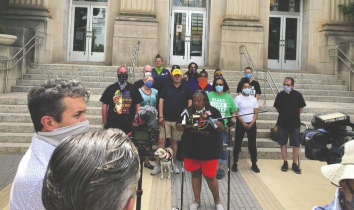 Rev. T. Sheri Dickerson, the executive director of Black Lives Matter OKC, holds a press conference Monday outside the Oklahoma City Municipal Building to go over the group’s demands. Among the demands is to create an independent review board for complaints about officers, including ones alleging racial profi ling. Trevor Brown • Oklahoma Watch