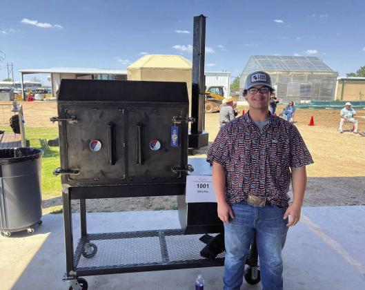 Madill FFA traveled to Hartley, Tx to participate in the Top of Texas AG Mechanics show. Morgan Walls, left, took 1st in the outdoor furniture class, and was the Recreation Division Champ. Vincent Murphy, right, took 2nd in a competitive smoker class. Courtesy photos