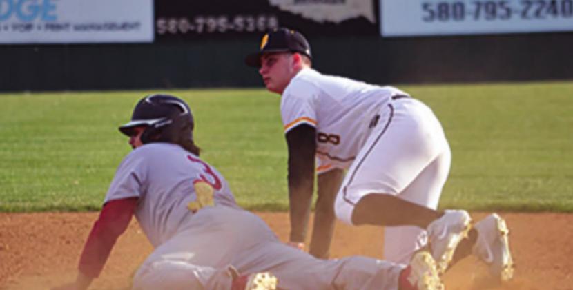 Ty Rushing tries to tag the runner out during the Madill v Cougars game on March 1, 2021. Summer Bryant • The Madill Record