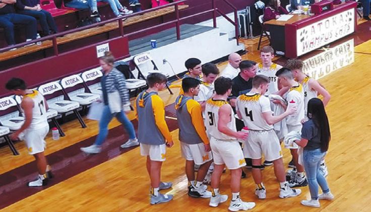 Michael Haggerty • For The Madill Record The Madill Wildcats boys basketball gathers around head coach Brett Weiberg (center wearing a black polo) during a timeout against the Pauls Valley Panthers on Jan. 25.