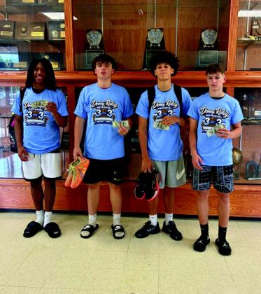 The 1st Annual Donny Raley Memorial 3-on-3 Basketball Tournament was held in honor of the late Donny Raley. The winners from left to right: The Bums, 13 and under division; BTA, 14-18 division; The Goonies, 19 and up division.