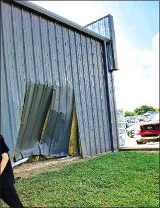 Courtesy Photo • Jennifer Lines A driver lost consciousness while driving, clipped a stabilization cable, jumped a ravine and landed in the Eastside wall of the Kingston Family Dollar.