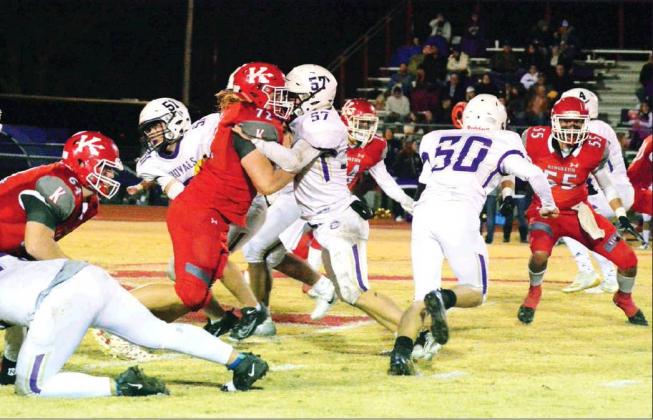 Tony McSwain • For The Madill Record A group of Kingston defenders battle aginst the Community Christian School Royals in their first round playoff game Nov. 15. The game was moved to Madill’s stadium due to a power outage.