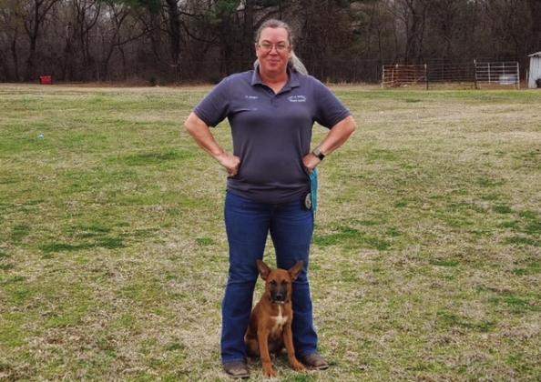 Billie Krager, the Madill Animal Control Officer, posing with one of the shelter dogs. Courtesy photo