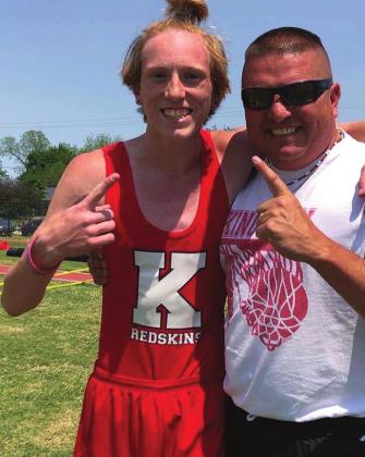 Andrew Backenstoes and Coach Jones Jones celebrating his first place finish at the 2022 regional track meet. Courtesy photo