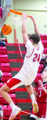 Kingston Redskin Reid Cason makes a slam dunk. Matt Swearingen