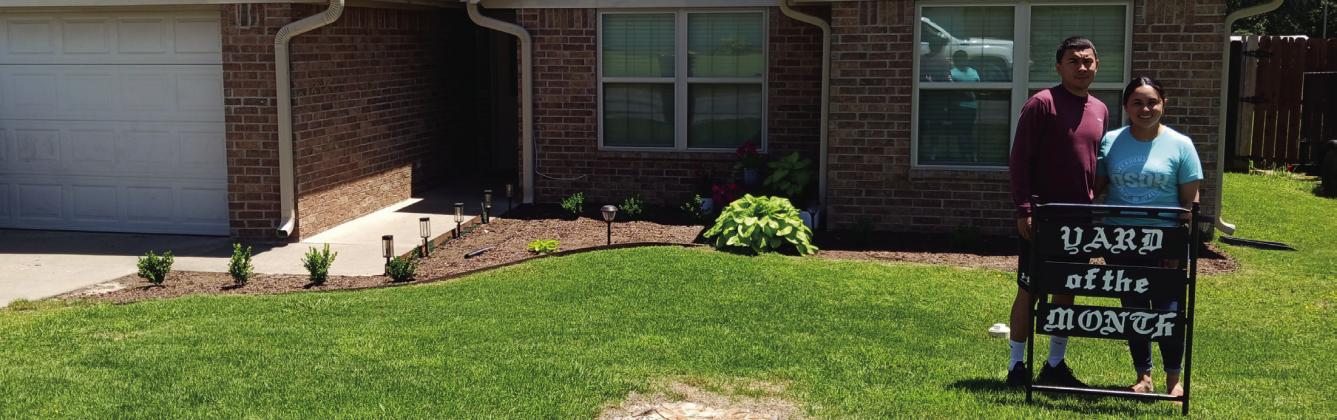 Courtesy photo David and Ana Duran on Roger Avenue were named the Madill Rose Garden Club May 2025 Yard of the Month. The home features a small, well-kept yard with boxwood shrubs lining the front walk. Bright hostas accent the corners, complemented by petunias.