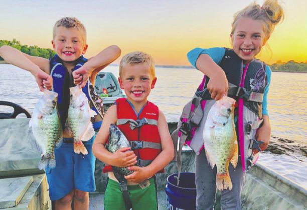 Matthew, Owen, and Katie are having a blast catching crappie on Lake Eufaula. Introduce someone to fi shing on Oklahoma’s Free Fishing Days on June 6-7, when everyone can fi sh without a state license. Courtesy Photo