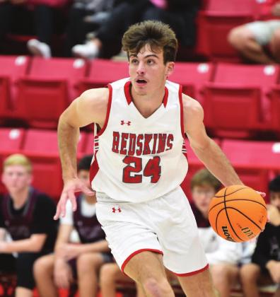 Crockett Uber Senior Braden Matchen of Kingston dribbles down the court during the Kingston v. Atoka game on Tuesday, November 30, 2021. The Redskins won 49 to 42.