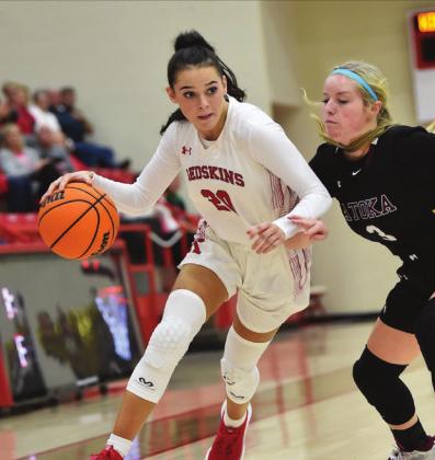 Crockett Uber Junior Kamry Bohannon fights off an opponent during the Kingston v, Ada game on December 3, 2021. The Lady Redskins won 62 to 41.