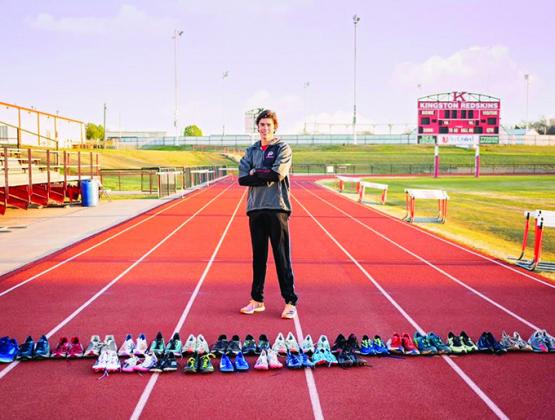 Brycen Ward has ran over 7,000 miles over his running career. Ward poses with all his running shoes. Jenna Koestner Photography.