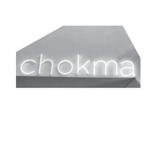 The neon sign stating “Chokma” welcomes visitors. Staci Stewart