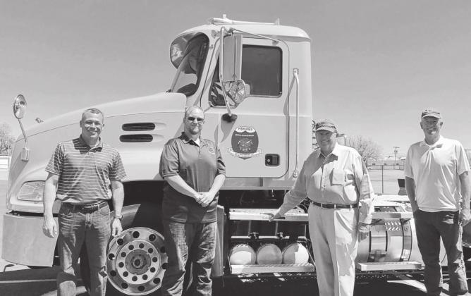 Groendyke Transport Inc. of Enid donated a 2013 Mack Trucks semi-tractor to the Wildlife Department's Fisheries Division. Gathered for the presentation are, from left, Chas Patterson, Northwest Region Fisheries Supervisor; Colby Rowe, heavy equipment operator; John D. Groendyke, CEO of Groendyke Transport Inc.; and Barry Bolton, Fisheries Chief.(ODWC Photo)