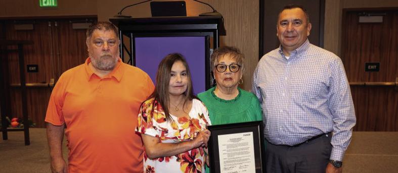 Joanna Hawkins, second from right, and the family of the late Byron “Larry” Hawkins accept the CHS Lifetime Service Award. Courtesy photo