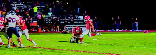 Freshman Jaime Lewis kicking the winning field goal as time expires during the Kingston v Atoka game. The Redskins broke their non-winning streak when they beat Atoka 24 to 21. Mindi Weeks