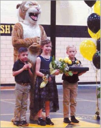 Courtesy photo Israel Hernandez, Cora McGee, and Silas Hart pose with Willie the Wildcat at the Madill Wrestling 2020 Homecoming.