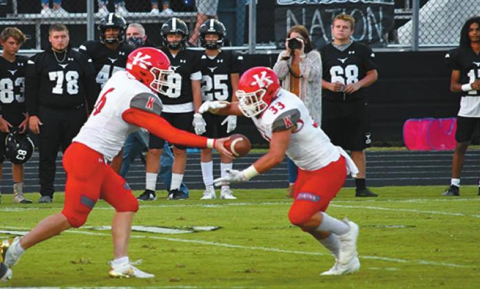 Running back Brandon Watson (#33) takes the handoff from quarterback Jase Hayes (#6) while Dakota Beshirs (#62) and the rest of the offensive line pave the way for Watson’s 200-yard night vs. Lone Grove. Linda Holmes