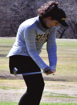 Abby Zang takes a swing during the Golf Tournament on March 23, 2021. Summer Bryant • The Madill Record