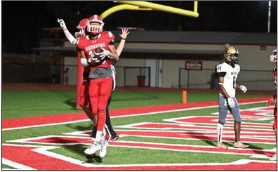 Junior Sammy Walker celebrates in the end zone after scoring a touchdown during the Kingston v. Hugo game on September 8. Courtesy photo