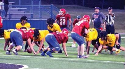 Photo by Matt Caban • The Madill Record The Madill Wildcat offense prepares to run a play against the Durant Lions in a scrimmage August 23 at Paul Laird Field in Durant. Madill head football coach Todd Vargas said his team held their own against their hosts, who play in Class 5A. Madill plays in Class 4A.