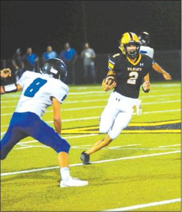 Crockett Uber • Courtesy Photo Wildcat Ryan Shahan #2 sets to out maneuver the Comet defender.