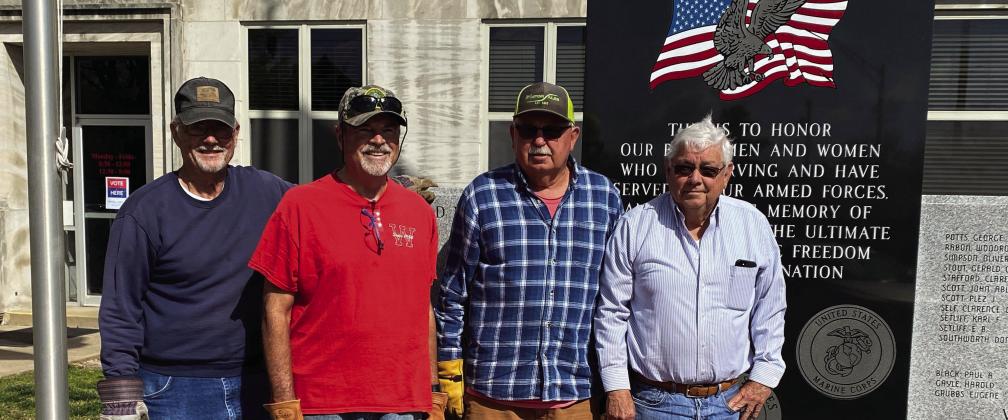 American Legion members place memorial bricks