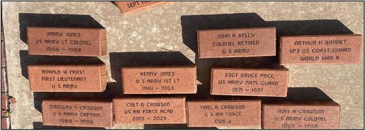 American Legion members place memorial bricks