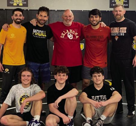 The Madill Takedown Club hosted International Gold Medalists. Bottom row, from left to right: Triston Barnes, Brylan Slover and Rylend Slover. Top row from left to right: Rio Zamora, Peter Hammer, Roger Frizzell, Mirzo Khayitov and Scott Clement. Courtesy photo
