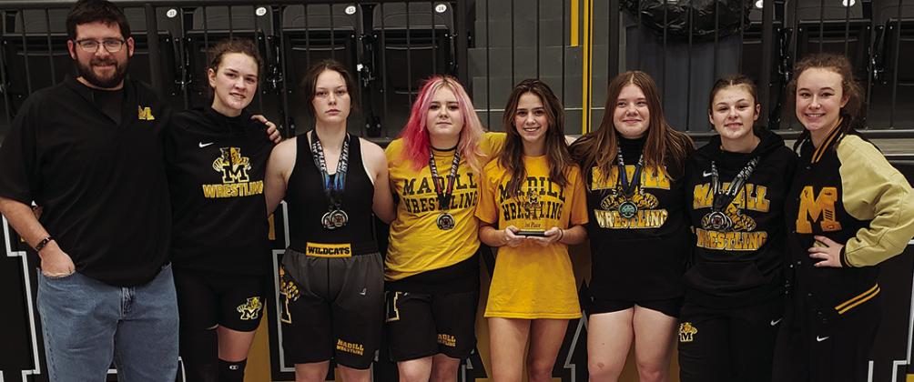 Photo (l-r): Madill assistant wrestling coach Austin Pettigrew, Tarah Wiese, Kaz Christian, Maddie Barrow, Rylee Mathews, Maddie Ritchie, Kaia Henry and Codie Shaw (Camila Vargas not pictured). By Leslie Mowles reporter@madillrecord. net Madill high school wrestlers took over the Madill Thrill Tournament as the girls’ team took home Courtesy photo