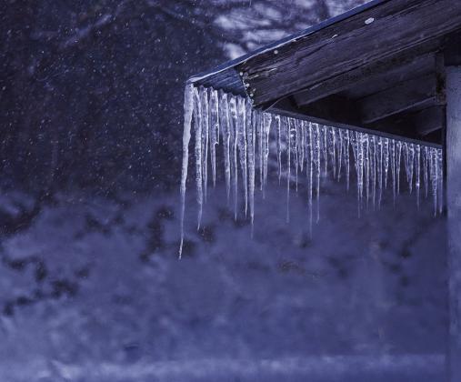 Ice dams may help create a picturesque winter vista, with icicles hanging and glinting in the sunlight, but they can cause significant damage. Courtesy photo