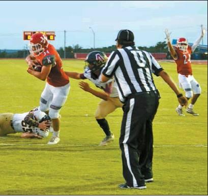 Lori Robinson • The Madill Record Redskin Tanner Showalter crosses the goal through two Wampus Cats, as AJ McKinney celebrates the touchdown during Friday night’s game against Atoka.