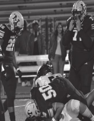 Summer Bryant • The Madill Record Joel Gonzalez tackles two Little Axe players during the Senior Night while Cornelius Smith and Danny Lima look on.