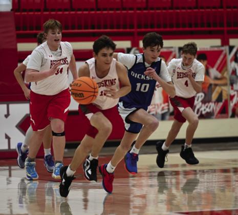 The Kingston Middle School boys basketball team beat Dickson in all three games in the tournament on February 2. Left top: Coach Hayes talks to the sixth grade basketball team. Right top: Seventh grader Lathan Arnold dribbles down the court. Bottom left: Eighth grader Koewyn Young goes up for a layup. Courtesy photos