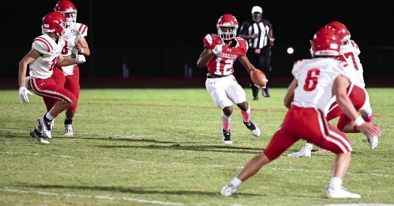 Devon Tipton, #12, receives the punt during the Kingston v Davis. Mindi Weeks
