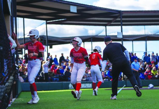 Two KHS Lady Redskins celebrate after scoring. Layton Corntassel