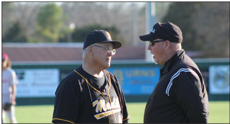 Wylbe Roberts makes the pitch as a Marlow runner is leading off of first base. Glenn Price • The Madill Record