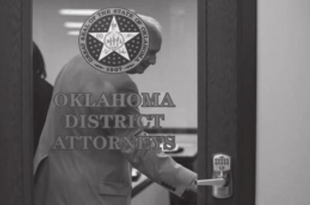 District Attorney David Thomas, who represents Greer, Harmon, Jackson, Kiowa and Tillman counties, closes the door at the start of the private District Attorneys Association meeting in June 2019. Whitney Bryen • Oklahoma Watch