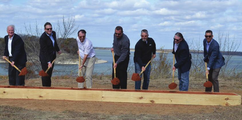 Pointe Vista executives and board members held a ground breaking ceremony to mark the construction of phase one of the new Pointe Vista development. From left to right: Mark Fischer, Owner Pointe Vista Development; Grant Speaks, Chief Operating Officer; Still Fontaine, Equity Bank; Steven Callendar, COO Skybridge Development; Paul Brightwell; Ryan Chapman, Operations Manager; and Malek Massad, FO Skybridge Development. Summer Bryant • The Madill Record