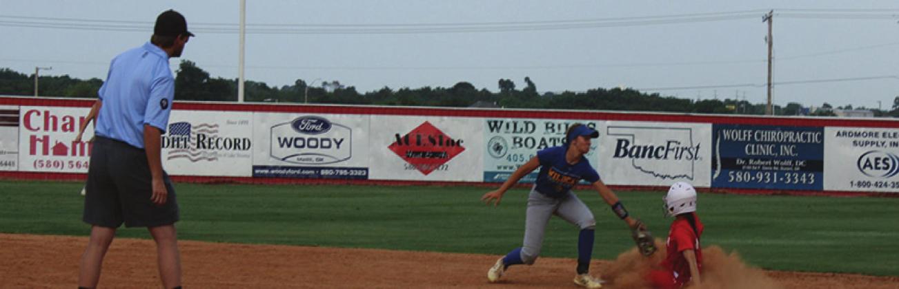 Kingston Lady Redskin’s senior Lanie French slides into second base during the scrimmage game against the Thackerville Wildcats on July 21. She was determined safe by the umpire. Gary Jackson