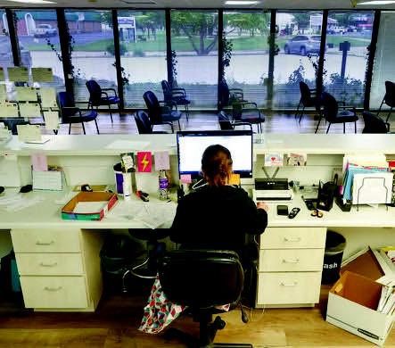Registered Nurse Tiffany Taylor works on paperwork as the waiting room sits empty at the Tulsa Women’s Clinic in June 2022. Rip Stell • Oklahoma Watch