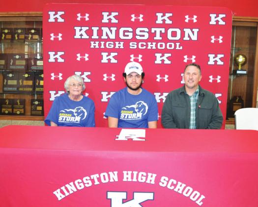Kingston senior Jesse Rouse signs his National Letter of Intent to play golf for the Southeastern Oklahoma State University Savage Storms in Durant at a ceremony Feb. 10 inside the KMAC. Joining Jesse at his signing were his grandmother Doris Rouse, and Kingston Golf coach Clayton Hodges. Matt Caban • The Madill Record