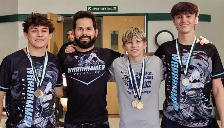 Left to right: Jace Davis, Coach Peter Hammer, Billy &amp;amp; Joey Arbuckle sporting their medals. Courtesy photo